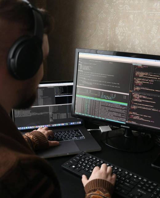 Developer programming on two screens